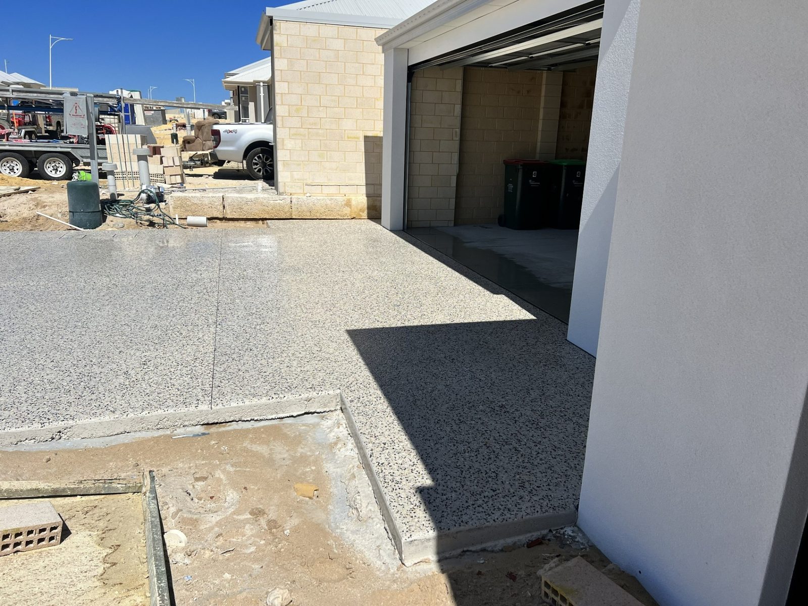 Exposed aggregate driveway and garage entrance