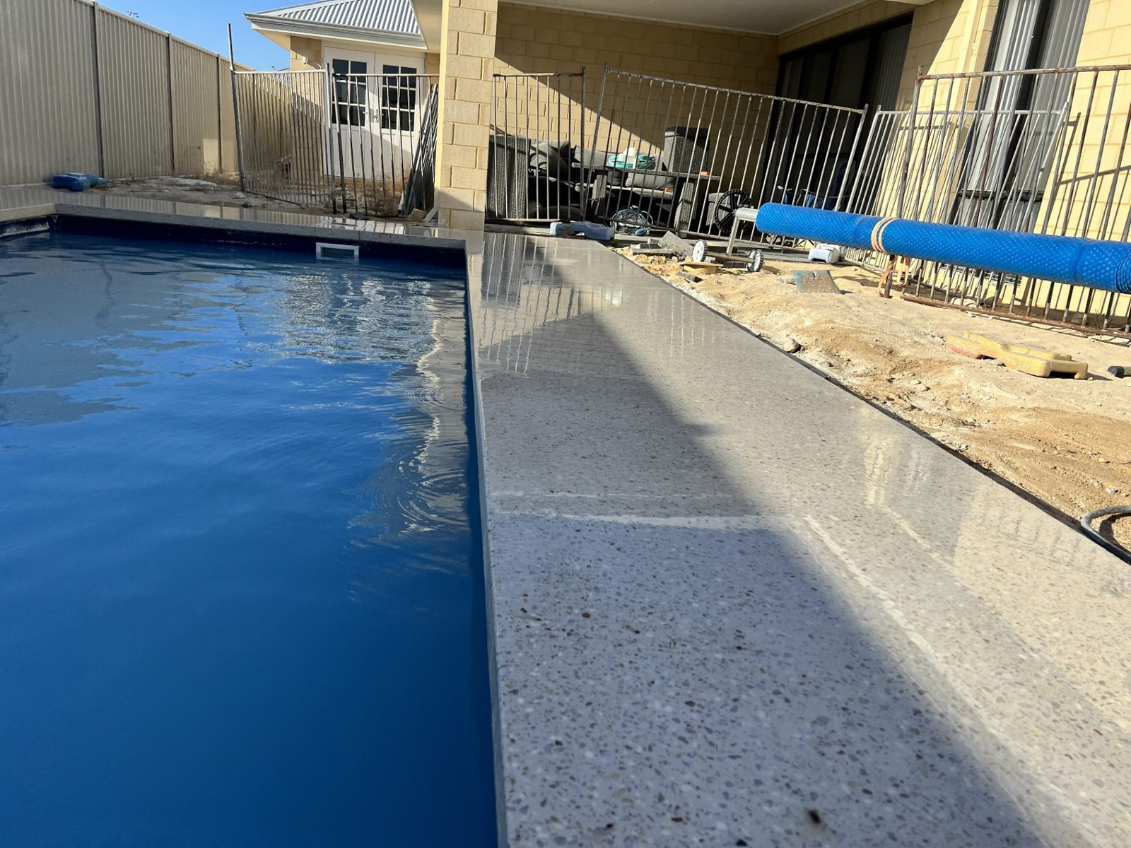Honed concrete pool surround