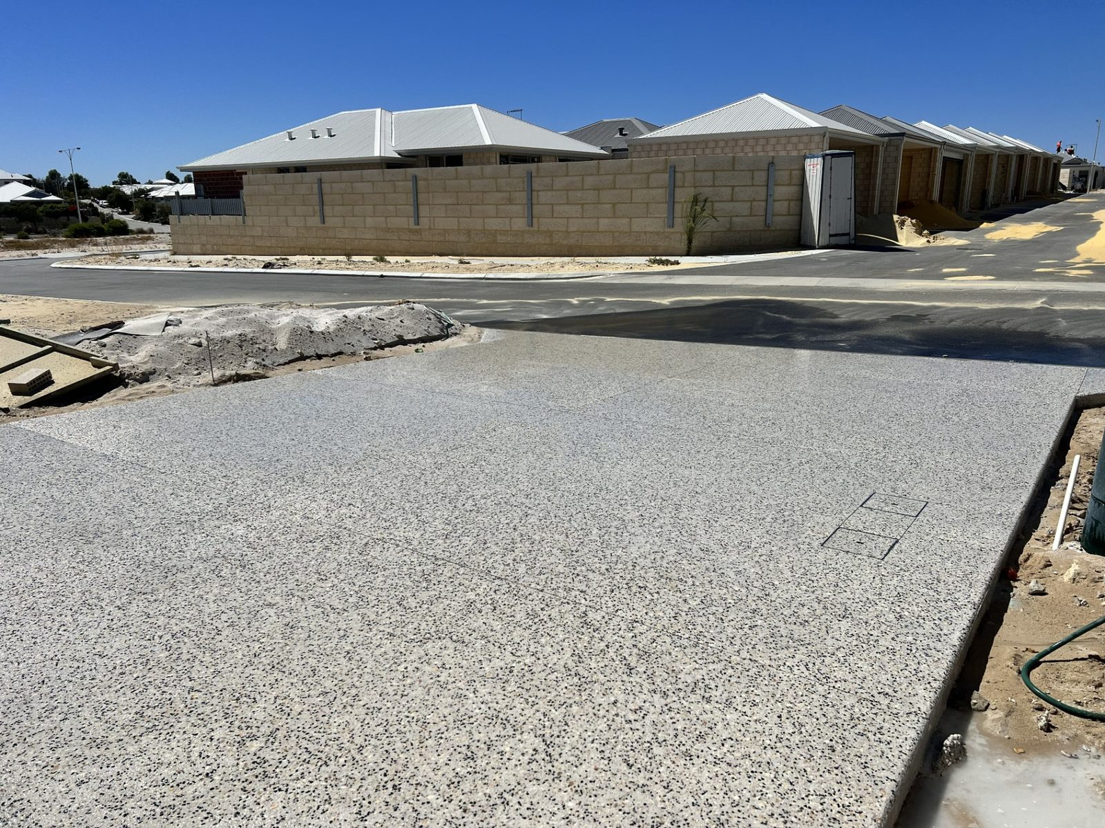 Fresh exposed aggregate driveway in a new estate